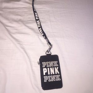 a pink land yard wallet